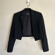 Aritzia Ten By Babaton Cropped Black Blazer Never Worn, Like New Shoulder Pads Size 2xs Shoulders: 15" Arms: 23" Back Length: 17" Front Length: 19" Classic Black Cropped Blazer, Classic Black Cropped Jacket For Formal Occasions, Black Cropped Jacket For Business, Black Cropped Blazer For Evening, Black Cropped Blazer For Party, Black Cropped Evening Blazer, Formal Black Cropped Jacket, Black Tailored Cropped Jacket In Classic Style, Tailored Classic Black Cropped Jacket