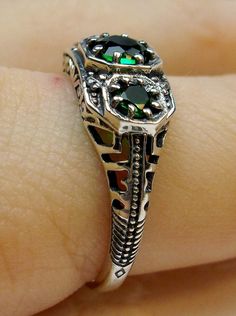 Art deco style ring with three green emeralds set in sterling silver filigree Art Deco Emerald Ring, Mystic Fire Topaz, 3 Stone Ring, Edwardian Ring, Natural Emerald Rings, Gem Art, 3 Stone Rings, Ring Art Deco, Sterling Silver Filigree