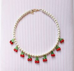 "Pearl necklace with Cherry charms. A trendy fruit charm pearl choker  It is sweet and has a Retro style. A must-have accessory of this summer! Wear it as a single one or layer some together. Pearl necklaces are delicate and playful.    Chain length can be adjusted to your choice.  Details: Glass imitation perals Glass cherries Dimensions: Size: Length: 46 cm //18 \" + 8cm // 4 \" elongation chain.   More pearl necklaces: https://www.etsy.com/listing/743821343/ The necklace will be packed with m Glass Cherries, Retro Cherry, Colorful Beaded Necklace, Jewels Diy, Cherry Necklace, Diy Hair Accessories Ribbon, Cherries Jubilee, Necklace Trendy, Necklace Colorful