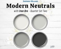 three paint cans with the words modern neutrals on them and white flowers in the background