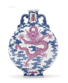 a blue and white vase with a pink dragon on it's body in the sky