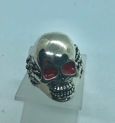 Red eyes skull Ring Biker skull Ring Brand New.   Hand claw details  Sizes Available:  6,7,8,9,10,11,12,13,14 and 14 1/2. By Zevria Jewelers Punk Skull Ring For Streetwear, Punk Skull Ring For Biker Events, Silver Skull Ring For Streetwear, Punk Style Skull Ring For Halloween Collectible, Biker Style Skull Jewelry, Silver Punk Skull Ring, Punk Skull Ring For Halloween Streetwear, Edgy Skull Ring As A Gift, Silver Skull Ring For Halloween Streetwear