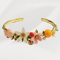 Orange Cherry Flower Bracelet is a great flower bangle from nature jewelry collection on Selenichast online shop. This bracelet is an outstanding piece of enamel jewelry with good details ﻿Don’t miss this delicate bangle bracelet. This golden brass bracelet with white, pink flowers sparkling with their bright cut crystal heart and enameled orange is designed for women to light up everyday outfit. This vividly colourful and unique piece of bracelet serves as the perfect addition to your bracelet Cherry Flower, 18k Gold Bracelet, Fluffy Bunny, Brass Bracelet, Enamel Bracelet, Themed Jewelry, Enamel Flower, Affordable Jewelry, Flower Bracelet