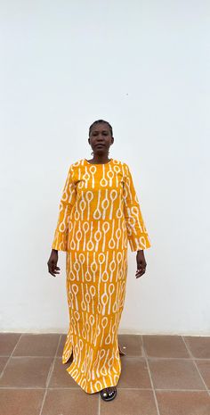 ▪️100% cotton ▪️100% handmade batik ▪️Maxi dress ▪️Long sleeve ▪️Two side pockets ▪️Yellow & white colour FABRICS ▪️Please send us a message for fabric gallery if you would like your dress done in another fabric (print) MEASUREMENTS ▪️Size XS - 3XL ▪️Please find size chart on the photos ▪️Dress can be made to your desired length ▪️Please start an Etsy conversation to inquire CARE INSTRUCTIONS ▪️Handwash with cold water ▪️Do not bleach ▪️Low iron inside out RETURNS & EXCHANGES ▪️We do not accept returns and exchanges CANCELLATIONS ▪️An order can be cancelled within 24 hours. DELIVERY & SHIPPING ▪️Express delivery via DHL ▪️3-5 working days for order processing ▪️3-5 days for shipping and delivery WHOLESALE ▪️We accept wholesale orders ▪️Please start an Etsy conversation to inquire Yellow Cotton Dress With Batik Print, Yellow Long Sleeve Dress With Block Print, Long Sleeve Yellow Dress With Block Print, Maxi Dress Long Sleeve, Maxi Dress Long, Fabric Print, Dress Long Sleeve, White Colour, Long Sleeve Maxi Dress