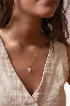 This shimmery Mother of Pearl Cross Necklace is the perfect spring white to add to your wardrobe (or jewelry box)!
Handmade by Token Jewelry and waterproof, hypoallergenic, and nickel free. Elegant White Cross Necklace With Adjustable Chain, White Cross Necklace With Adjustable Chain, Cross Necklace For First Communion, White Cross Necklace As A Gift, Cross Pendant Jewelry For First Communion, White Cross Necklace For First Communion, First Communion Cross Pendant Jewelry, Minimalist White Crucifix Jewelry, White Cross Necklace For Everyday