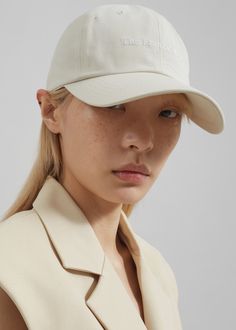 Color: Ivory Cotton twill  Classic baseball cap Embroidered logo Curved visor Adjustable back tab 100% Cotton Hand Wash  By The Frankie Shop. Imported Classic Baseball Cap With Curved Visor For Baseball Season, Classic Baseball Cap With Curved Visor, Classic Dad Hat With Embroidered Logo Visor, Classic Dad Hat With Embroidered Logo, Solid Baseball Cap For Everyday Spring Wear, Classic Adjustable Cream Baseball Cap, Classic Baseball Cap For Baseball Season With Visor, Classic Baseball Cap For Baseball Season, Classic Visor Baseball Cap With Embroidered Logo