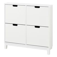 a white cabinet with two black handles and drawers on the bottom, against a white background