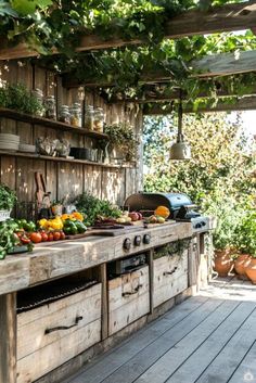 an outdoor kitchen with lots of vegetables on the counter