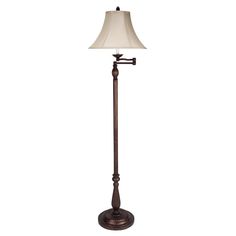 a floor lamp with a white shade on it's base and a wooden pole