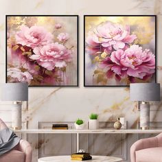 two pink flowers are displayed on the wall in this living room with marble tables and chairs