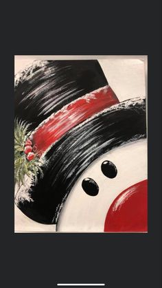 a black and white snowman with red hat on it's head is shown