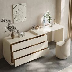 a white desk with two drawers and a mirror on the wall next to a chair