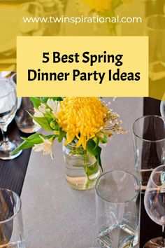 a table topped with glasses and vases filled with flowers