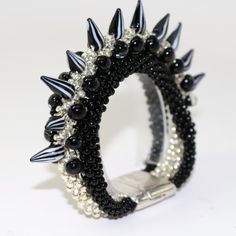 Triple Tier Spiked Bracelet by ComplimentsByDesign on Etsy Spiky Bracelet, Edgy Black Spiked Bracelets, Black Rock Bracelets With Spikes, Black Leather Spiked Bracelets, Adjustable Black Spiked Jewelry, Spiked Jewelry, Ombre Necklace, Spike Bracelet, Kumihimo Jewelry