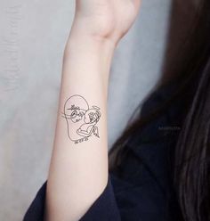 a woman with a tattoo on her arm