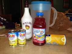 the ingredients for making an ice cream sundae are displayed on a counter top, including yogurt, lemonade, and more