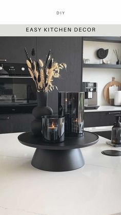 an image of a kitchen setting with candles on the counter and in front of it