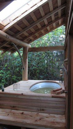 a hot tub in the middle of a wooden deck