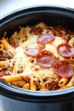 This easy Crockpot pizza casserole will quickly become a new favorite! With pasta, pepperoni, and plenty of cheese, it's tough to resist!