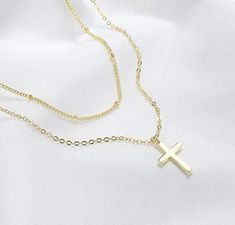 Super cute and dainty tiny cross charm on dainty chain 18k gold plated, Silver plated, 18k gold filled, or sterling silver. Gold vermeil sterling silver charm. Hypoallergenic nickel & lead free material -Silver plated cable chain -Silver plated satellite chain -18k Gold plated cable chain -18k Gold plated satellite chain -Sterling silver cable chain (read description below) -14k gold filled cable chain (read description below) Simple, Dainty, Delicate, yet so Elegant and Romantic. The shine Gold Minimalist Tarnish Resistant Cross Necklace, Dainty Charm Necklace With Clavicle Chain And Cross Pendant, Dainty Cross Pendant Charm Necklace With Clavicle Chain, Gold Adjustable Minimalist Cross Necklace, Gold Plated Double Strand Necklace Gift, Gold Plated Double Strand Layered Necklace For Gift, Double Strand Gold Plated Layered Necklace As Gift, Dainty Cross Necklace With Delicate Chain, Gold Dainty Cross Necklace With Adjustable Chain