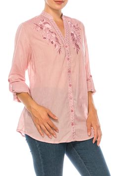 Featured on a solid pink background, this button-down tunic is made from 100% light-weight cotton voile fabric, with exquisite embroidery on the collar, yoke, and the placket. It is also treated with a vintage wash. Model is 5’8” - wearing size small. Model Bust: 34” Hand-wash cold, lay flat to dry.Made in India. Spring Split Neck Blouse With Placket, Pink Floral Embroidered Blouse For Daywear, Pink Embroidered Button-up Blouse, Pink Blouse With Embroidered Neckline For Spring, Pink Button-up Tops With Floral Embroidery, Spring Cotton Button-up Tunic, Pink Blouse With Placket For Spring, Pink Chikankari Embroidery Blouse, Spring Cotton Tunic With Embroidered Neckline