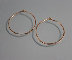 "These hoops are made of hand hammered 18 ga 14k Gold Filled. Approx. 1\" diameter. They are bent and hammered and then polished to a glittery shine by me. A basic essential to have. All items are presented in a 100% recycled paper box with a paper raffia bow. Thank you for looking at my shop. http://www.etsy.com/shop/tinysparklestudio?ref=si_shop For vintage clothing and uniquities, check out my hubby's shop Joestitchn http://www.etsy.com/shop/JoeStitchn?ref=si_shop" Anniversary Hammered Hoop Earrings, Rose Gold Hammered Small Hoop Earrings, Hammered Hoop Earrings For Gift, Hammered Hoop Earrings As Gift, Gift Hammered Hoop Earrings, Hammered Rose Gold Hoop Earrings Gift, Paper Box, Recycled Paper, Vintage Clothing