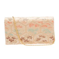 This exquisite bag is a tribute to classic Kyoto annd Geisha aesthetics. featuring a sophisticated gold color palette adorned with intricate brocade jacquard and floral  motifs that signify good luck prosperity, married life.  Crafted from premium brocade from Nishijin, Kyoto, Japan.  Whether carried as a shoulder bag or handheld, this bag exudes grace and elegance, making it a must-have for the modern woman with an appreciation for cultural heritage.  Mikimoto brocade Shoulder Bag •   Tradition Formal Rectangular Evening Bag With Gold Embroidery, Formal Rectangular Bag With Gold Embroidery, Gold Clutch With Gold Embroidery For Formal Occasions, Formal Gold Embroidered Evening Bag, Elegant Rectangular Ceremonial Bag, Traditional Gold Clutch For Ceremonial Occasions, Traditional Gold Formal Bag, Elegant Rectangular Ceremonial Bags, Elegant Ceremonial Rectangular Bags