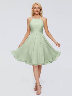 a bridesmaid in a short green dress with halters and pleaed skirt