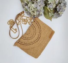 "Meet our crochet raffia crossbody bag, it will complete your bohemian summer look with a natural touch of raffia paper yarn. It can be used as a clutch bag by removing the strap! It's an everyday piece offering optimal capacity and easy transport with a long grab-and-go strap. It's also a great gift idea for your loved ones! Technical information : > It is exclusively handcrafted by talented women! > Main material 100% natural straw paper yarn > It has a 115cm long strap > The dimensions of the Wedding Clutch Purse, Clutch Bag Wedding, Crochet Wedding, Purse Handmade, Straw Clutch, Wedding Clutch, Handmade Gifts For Her, Raffia Bag, Summer Bag