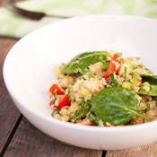 a white bowl filled with food on top of a wooden table