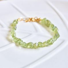 This beautiful bracelet is handmade with natural Peridot-Olivine beads and stainless steel. Its stones are natural and of good quality. ✨ DESCRIPTION - Bracelet size:  15.5cm + 5.5cm extender chain. - Handmade with 100% natural stones. - High quality stainless steel thread and clasps. 💧 CARE INSTRUCTIONS - Always store your jewelry in the included bag when not in use. - Wash your jewelry with a soft cloth and do not use any abrasive products. - Avoid wetting your jewelry with natural stones to Green Beaded Bracelets For Jewelry Making, Green Beaded Bracelets With Healing Stones, Green Beaded Bracelets For Healing, Green Healing Stones Beaded Bracelets, Nature-inspired Green Bracelets With Natural Stones, Green Beaded Bracelets With Stones As Gift, Green Beaded Stone Bracelets As Gift, Minimalist Green Beaded Bracelets With Natural Stones, Green Natural Stones Bracelet For Everyday