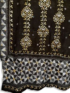 This traditional Phulkari dupatta is meticulously crafted with luxurious pure Chinon silk, featuring Gotta Patti hand embroidery. This black-hued piece is perfect for celebrations such as weddings, sangeet, jaago, and chunni ceremonies and boasts a striking metallic gold trim along the border. Effortlessly pair this dupatta with any color for an elegant contrast and make it an admirable present for birthdays or anniversaries. Material: Pure silk chinonWork: Silk thread phulkari handwork, needlew Black Dupatta For Diwali, Black Festive Dupatta For Diwali, Black Anarkali Dupatta For Transitional Season, Black Dupatta For Diwali Festive Occasion, Unstitched Black Traditional Wear, Black Dupatta With Traditional Drape For Festive Occasions, Transitional Black Salwar Kameez With Traditional Drape, Black Silk Traditional Wear With Dupatta, Black Unstitched Suit With Dupatta For Diwali