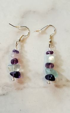 ⋄ Fluorite is a stone heralded for its spiritual detoxification abilities and tendency to transform negative energy into positive energy, boosting our mental clarity and     promoting peace of mind.  ⋄ Handmade dangle earrings made with high-quality fluorite stones and glass seed beads that hang on sterling silver ear wires ⋄ Total length of earring is 2 inches.    ⋄ Earrings are light and comfortable to wear. Great for any occasion. ⋄ Fluorite is a stone heralded for its spiritual detoxificatio Spiritual Dangle Earrings As Gift, Spiritual Crystal Earrings With Natural Stones For Gift, Adjustable Healing Drop Earrings, Adjustable Drop Earrings For Healing, Dangle Gemstone Jewelry For Meditation, Spiritual Earrings With Natural Stones For Gift, Healing Gemstone Dangle Jewelry, Handmade Crystal Drop Earrings For Healing, Spiritual Dangle Jewelry With Stones