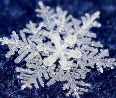 a snowflake is shown on a blue background