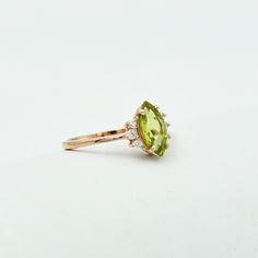 "Description Stone Name: Natural Peridot Shape : Marquise Stone Size : 5x10 mm Nickel Free) - also available in 925 sterling silver with rose gold plated Metal: 925 Sterling Silver Beautifully handcrafted as u can see in pics100% handmade more quantity available on demand We accept Custom Order If you have any questions about this piece or if we can help you with any of our other products please feel free to contact us through Etsy I am more than happy to make customs orders or price for wholesa Green Marquise Diamond Promise Ring, Elegant Lime Green Birthstone Rings, Lime Green Gemstone Ring Jewelry, Lime Green Gemstone Ring, Green Marquise Diamond Ring With Prong Setting, Lime Green Peridot Jewelry For Wedding, Peridot Birthstone Diamond Ring Fine Jewelry, Green Gemstone Cluster Ring For May Birthstone, Lime Green Peridot Rings In Fine Jewelry Style