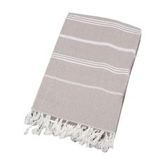 a gray and white towel with fringes on it