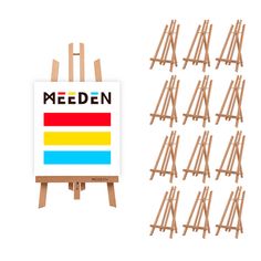 a wooden easel next to a group of paintings on canvases with the word meden written in bold colors