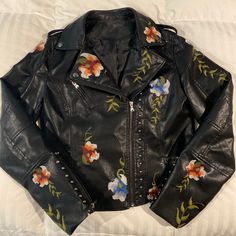 Very Pretty Faux Leather Jacket With Detailed Floral Embroidery. Super Cute! Never Worn. Flower Leather Jacket, Embellished Leather Jacket, Graphic Leather Jacket, Winter Embroidered Long Sleeve Biker Jacket, Embroidered Winter Biker Jacket With Long Sleeves, Embroidered Long Sleeve Biker Jacket For Winter, Embroidered Biker Jacket With Long Sleeves For Winter, Embroidered Fitted Biker Jacket For Winter, Embroidered Biker Jacket For Winter