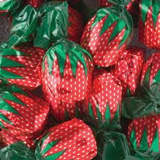 many red and green wrapped strawberries in plastic bags