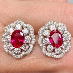 Anna Zuckerman Luxury Victoria 10 Carat Ruby Halo Stud Earrings In 925 Sterling Silver New!! Luxury Designer Azl Retail Price: $199 10 Carat Total (5 Ct Each Earring) 3 Carats Ruby (1.5 Ct Each Earring) 5 Carats (Total) Diamond Crystalline (2.5 Ctw Each Earring) Solid 925 Sterling Silver With Rhodium Plating Includes Gift Box & Jewelry Polishing Cloth July Birthstone Stunning Statement Jewelry! Each Earring Has A Faceted 1.5 Carat Oval Ruby Coated With Diamond Crystalline With 2.5 Carats Of Roun Art Deco Ruby Earrings, Red Halo Design Earrings For Formal Occasions, Formal Red Halo Design Earrings, Red Halo Earrings For Formal Occasions, Classic Red Halo Design Earrings, Red Diamond Hallmarked Earrings, Classic Red Diamond Earrings, Red Oval Halo Design Earrings, Aaa Quality Red Jewelry For Formal Occasions