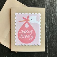 a card with a stork on it and the words special delivery written in pink