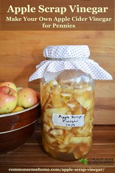 an apple cider vinegar recipe in a jar next to apples on a wooden table