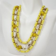 Good preowned condition, normal vintage wear. Necklace is 17 1/2" long. Earrings are clip on. Please see pictures for details. Vintage Large Beads Jewelry, Polished Vintage Beads, Vintage Polished Yellow Beads Jewelry, Vintage Yellow Jewelry With Polished Beads, Vintage Yellow Jewelry With Beaded Chain, Vintage Yellow Beaded Chain Jewelry, Vintage Yellow Necklace With Colorful Beads, Vintage Yellow Jewelry With Large Beads, Handmade Vintage Yellow Beaded Necklaces