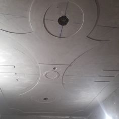 the ceiling is painted white and has circles on it