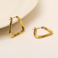 A twisted triangle hoop earrings that gives a bit of drama with fine gold plating. Hoops Earrings, Free Earrings, Earring Necklace, Ring Necklace, Gold Plating, Gold Bracelet, 18k Gold, Gold Plate, Hoop Earrings