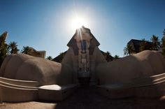 the sun shines brightly over an art deco building