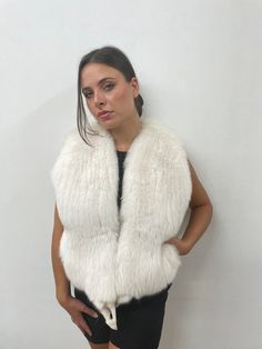 Fox fur vest white color full skin pelt fluffy and warm winter garment womans gift This vest is made from full skin of Fox pelt, natural white color, finished inside with white lining and closure with metallic clip. also has two pockets. Measures Chest: 98cm Length: 50cm Shoulders: 40cm Size 42 EU, M We send only first mail priority with tracking number! Please feel free to contact for any questions! Faux Fur Vest White, Faux Fur Lined Vest, Fluffy Vest, Fur Accessories Vest, Winter Faux Fur Vest With Trim, Rabbit Fur Vest, Fox Fur Vest, Color Full, White Fox