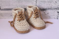 there is a pair of crocheted baby boots