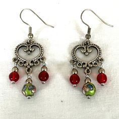 New Handmade Silver Plated Scroll Heart Shape Earrings With Green, Blue And Pink Cloisonne Beads, Garnet Red Acrylic Beads, And Antique Silver Beads With Antique Silver Fish Hook Ear Wires. This Is A Vintage Boho Dangle Drop Style. They Measure 2-1/4" Long And 1" Wide. * This Is A One-Of-A-Kind Pair Of Earrings. * There May Be Some Color Discrepancies Due To Different Monitor Settings. The Colors Are Described As Clearly And Genuinely As Possible. * All Items Are Created In A Smoke-Free And Pet- Heart Chandelier, Heart Shape Earrings, Cloisonne Jewelry, Silver Heart Earrings, Garnet Red, Silver Fish, Red Beads, Heart Shaped Earrings, Red Bead