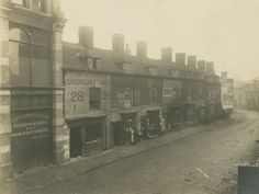 an old black and white photo of some buildings